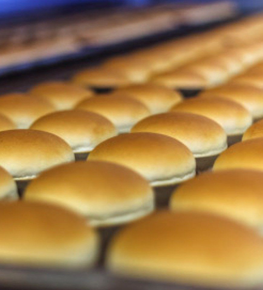 Northeast Foods sandwich buns on a baking sheet.